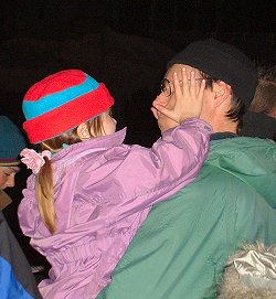 Girl touching dad's face