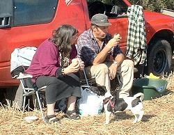 Couple & dog having lunch