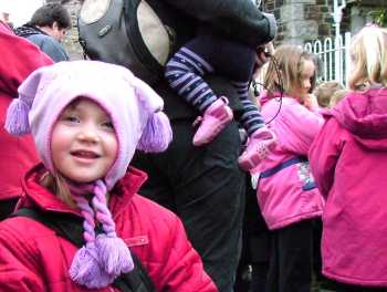 Girl in crowd in pink