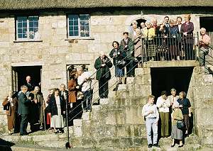 The crowd pose on the steps